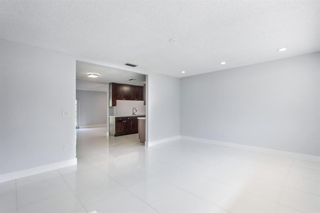 9611 Saddlebrook Drive Boca Raton, FL 33496 - Photo 11 of 15 a view of a kitchen with a sink and a stove