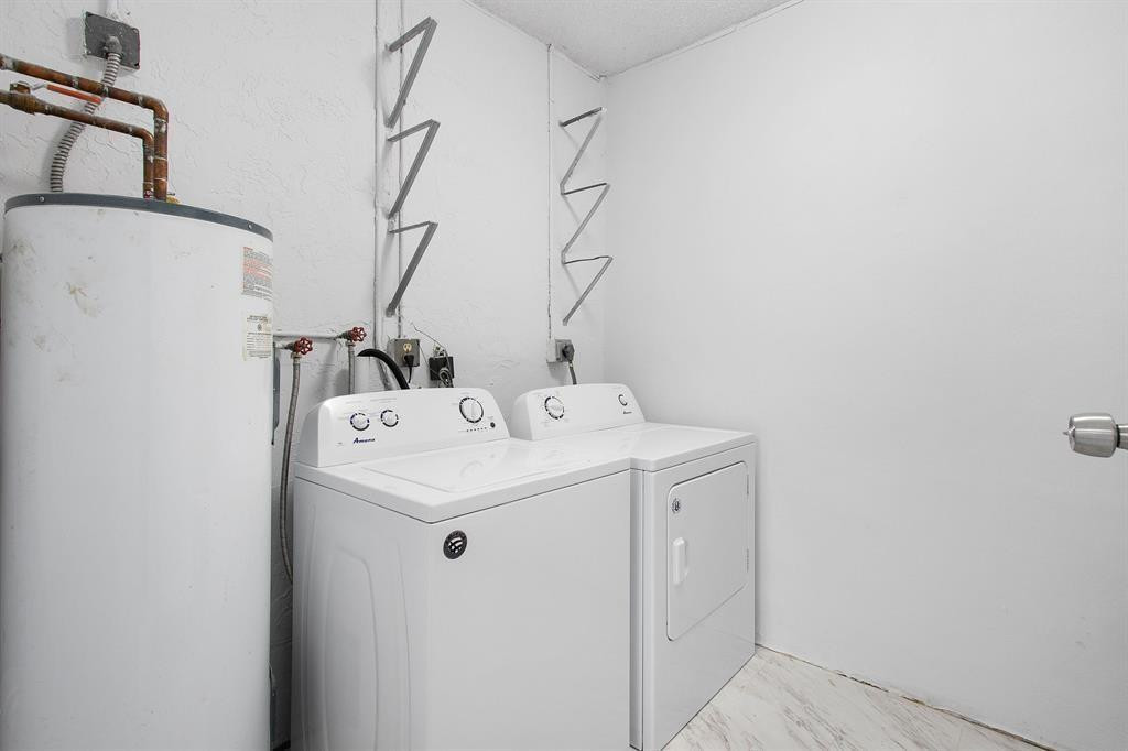 9611 Saddlebrook Drive Boca Raton, FL 33496 - Photo 13 of 15 a utility room with dryer and washer