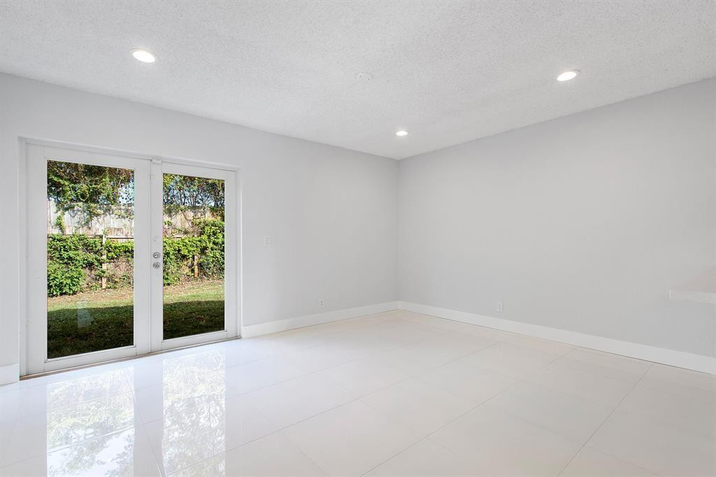 9611 Saddlebrook Drive Boca Raton, FL 33496 - Photo 14 of 15 a view of an empty room with a window