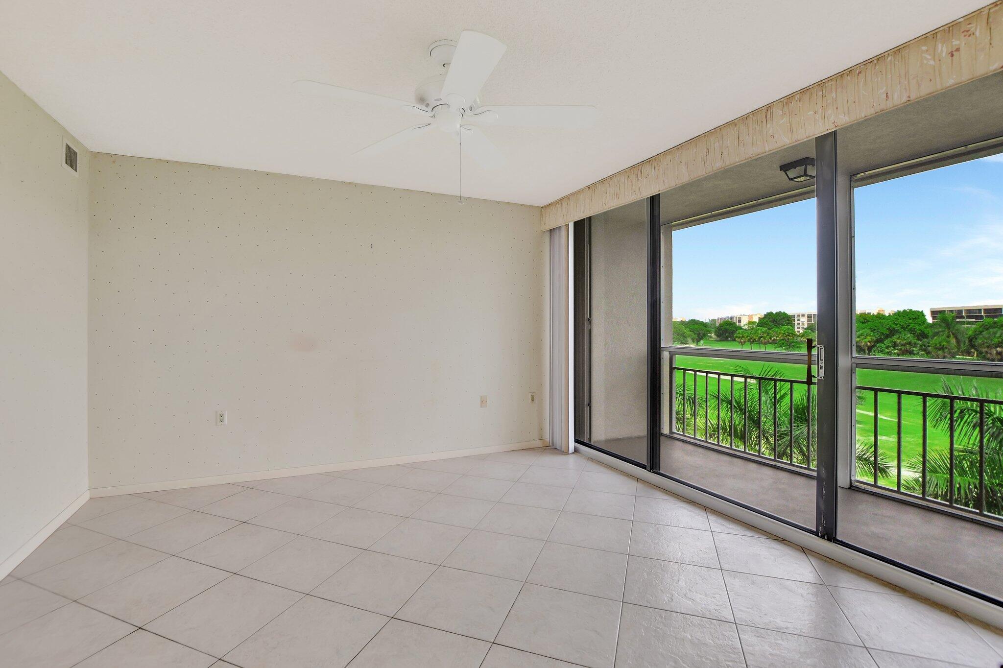 6145 Balboa Circle, Unit 405 Boca Raton, FL 33433 - Photo 16 of 25 Primary Suite & Screened Balcony