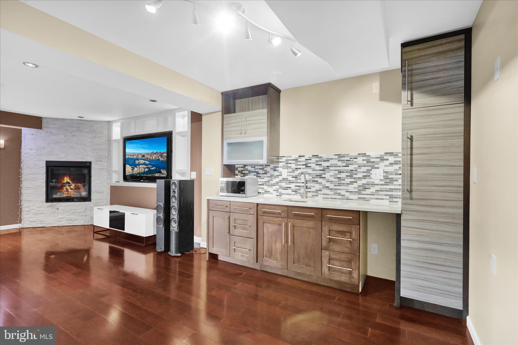 18 Bowes Lane Reading, PA 19606 - Photo 22 of 34 a large living room with stainless steel appliances granite countertop a couch and a wooden floor