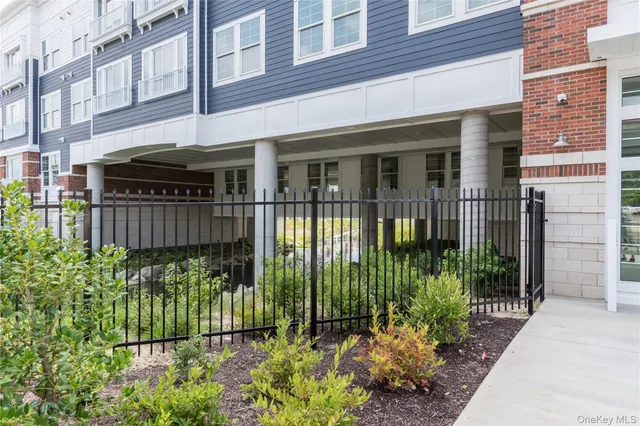 front view of a house with a garden