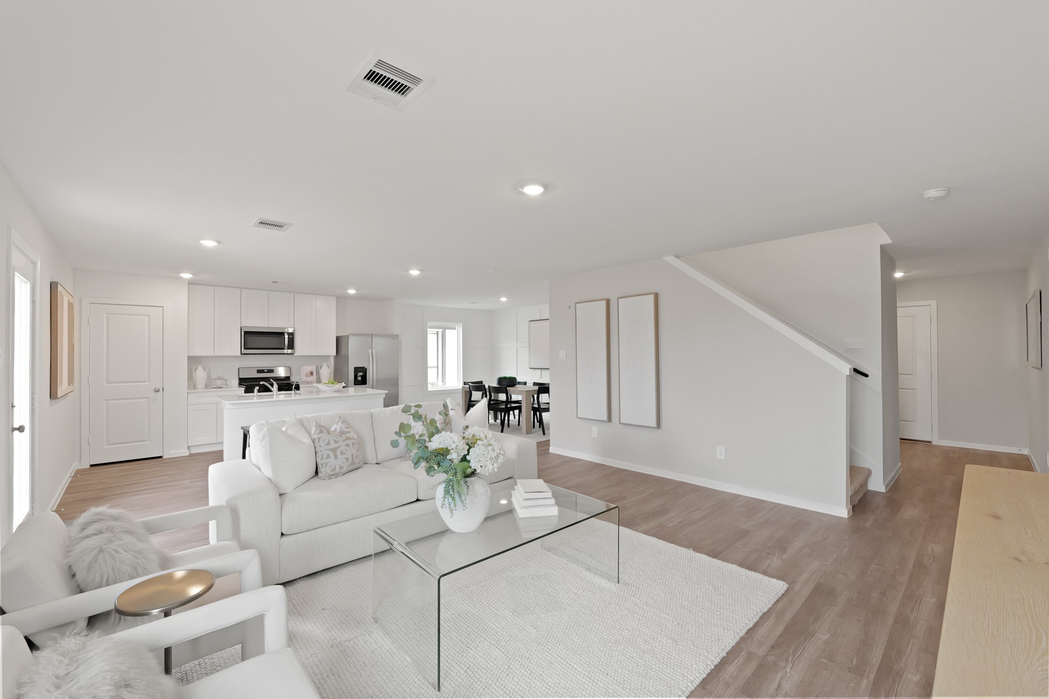 20034 Fibonacci Street New Caney, TX 77357 - Photo 7 of 24 a living room with furniture and white walls