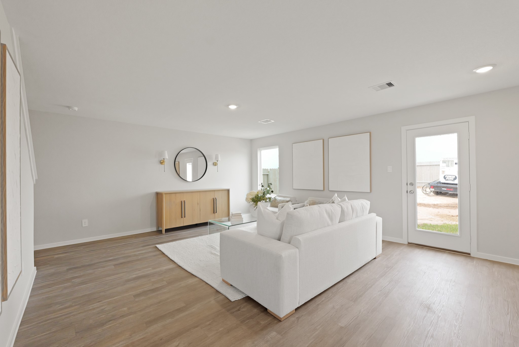 20034 Fibonacci Street New Caney, TX 77357 - Photo 9 of 24 a living room with furniture and a wooden floor