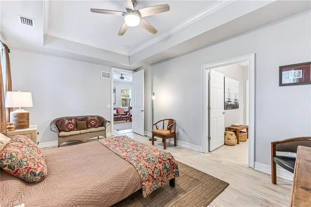 a bathroom with a granite countertop sink mirror vanity and toilet
