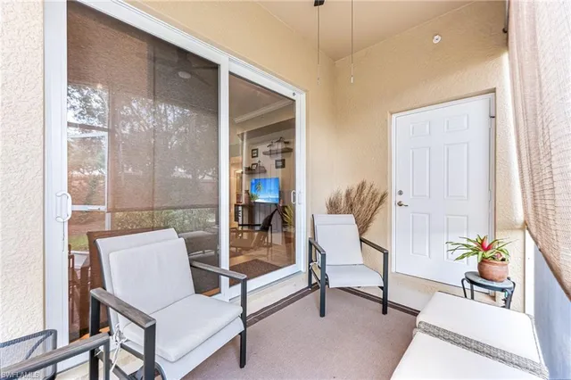 a outdoor living room with furniture and a garden
