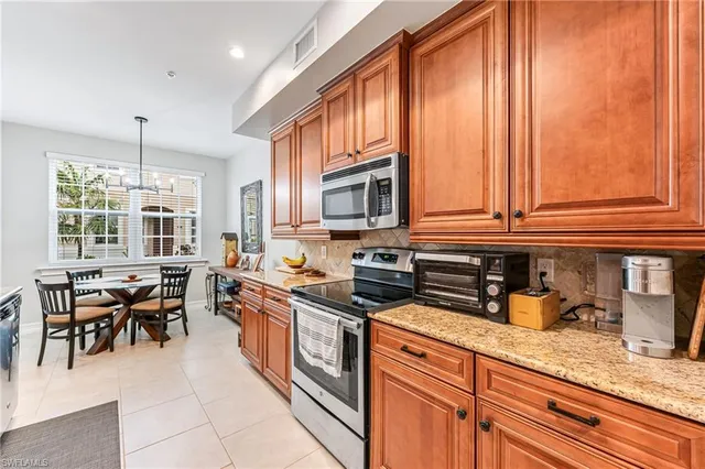 a large bathroom with a granite countertop double vanity sink a mirror and a shower