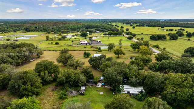a view of a swimming pool with a yard