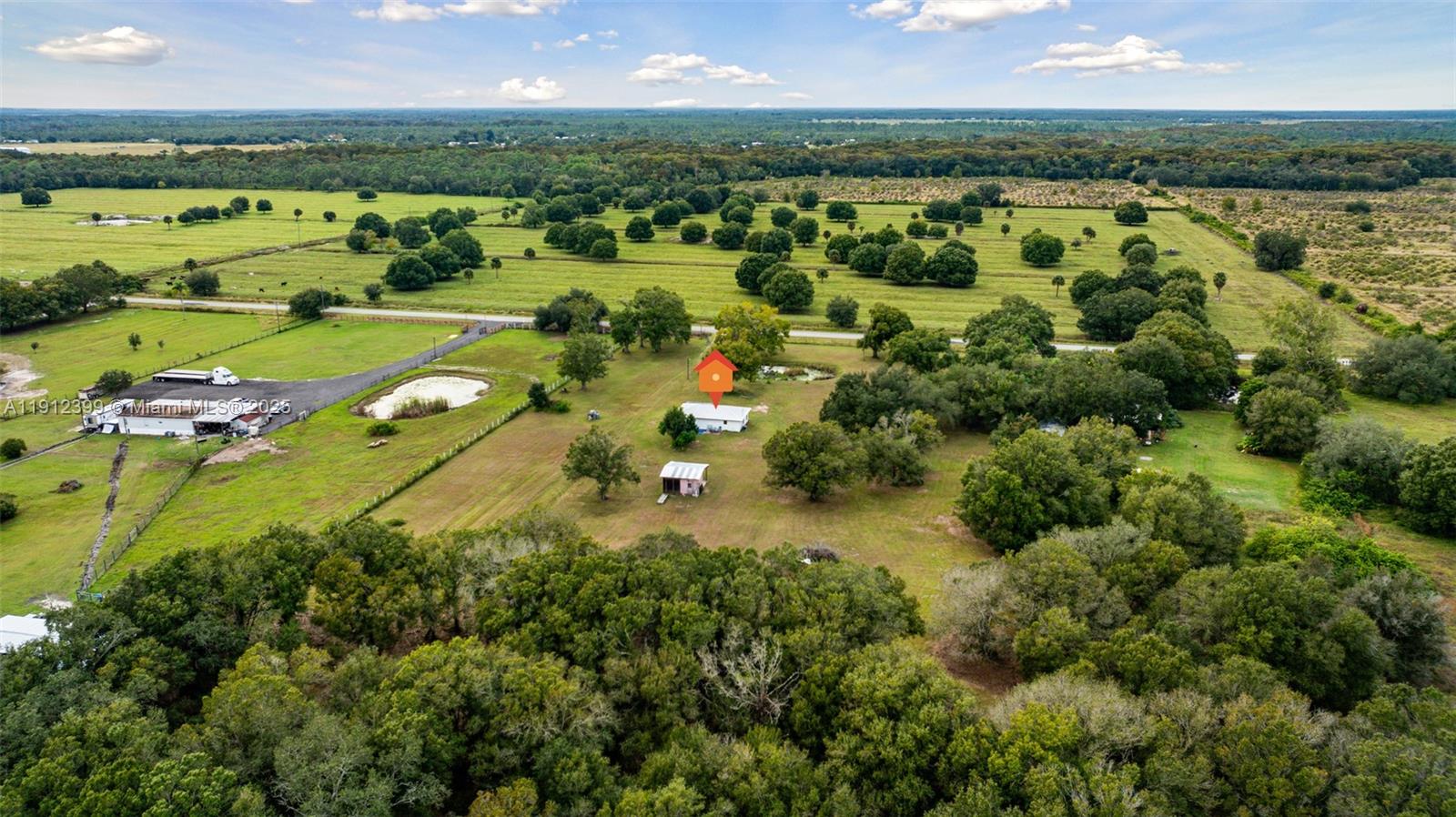 2404 Silver Lake Road LaBelle, FL 33935 - Photo 27 of 89 an aerial view of a houses with a lake view