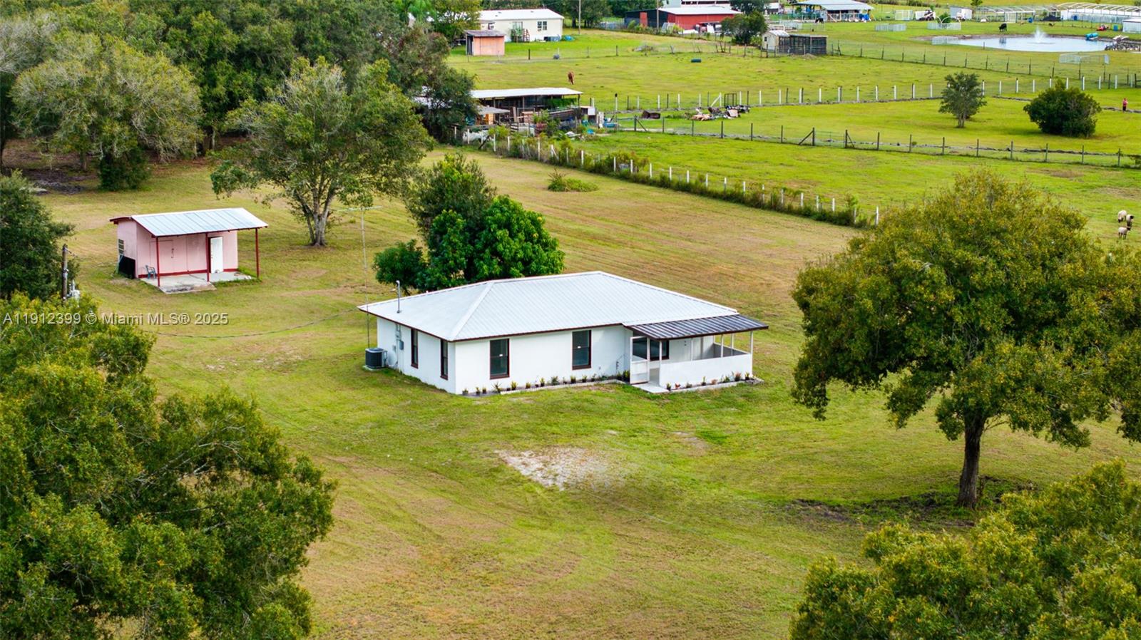 2404 Silver Lake Road LaBelle, FL 33935 - Photo 36 of 89 a view of a house with a big yard