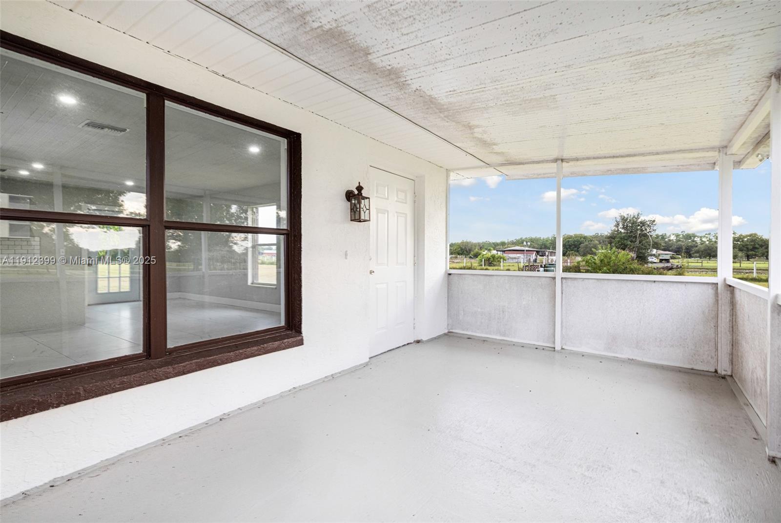 2404 Silver Lake Road LaBelle, FL 33935 - Photo 51 of 89 a view of an empty room with a window