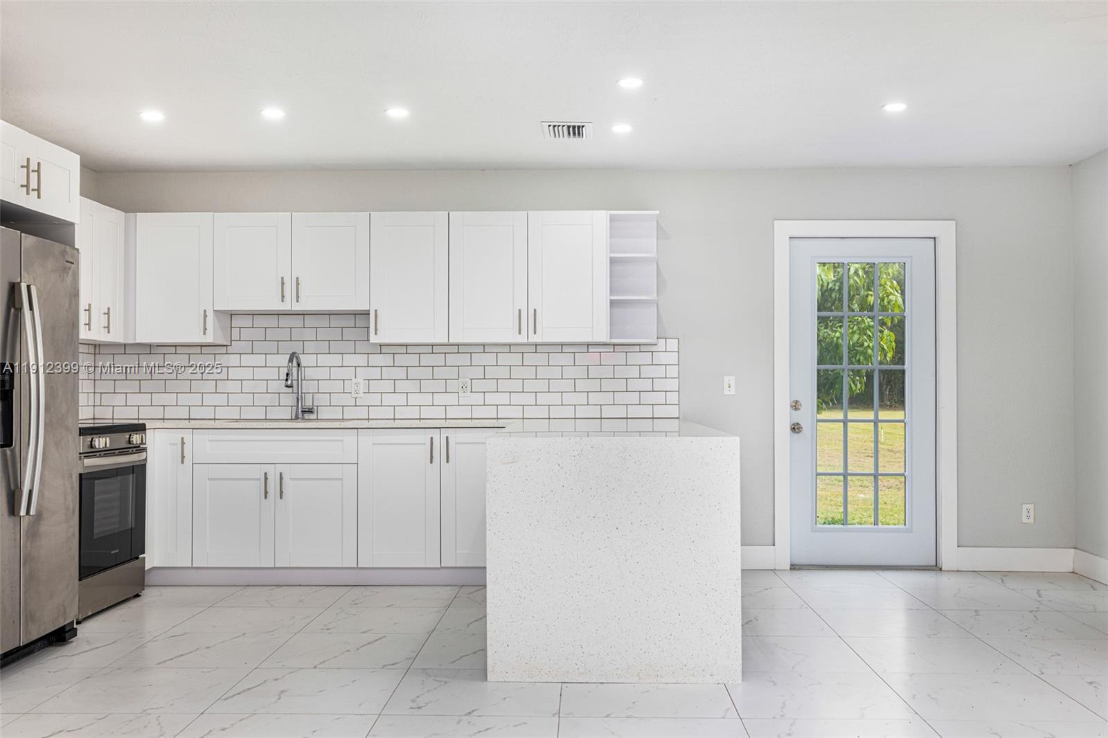 2404 Silver Lake Road LaBelle, FL 33935 - Photo 53 of 89 a kitchen with a sink and cabinets