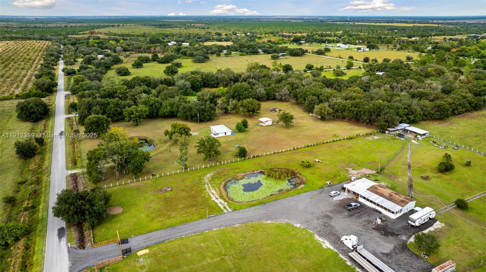 2404 Silver Lake Road LaBelle, FL 33935 - Photo 6 of 89 an aerial view of a pool with a yard