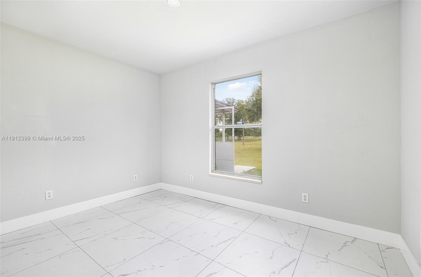 2404 Silver Lake Road LaBelle, FL 33935 - Photo 72 of 89 an empty room with a window
