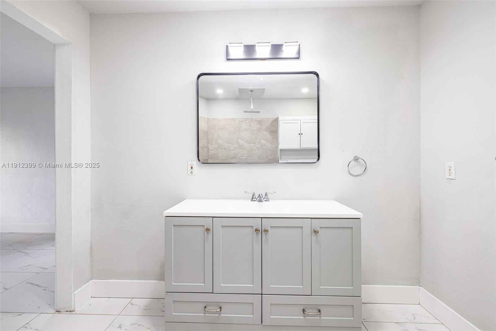 2404 Silver Lake Road LaBelle, FL 33935 - Photo 80 of 89 a bathroom with a sink and a mirror