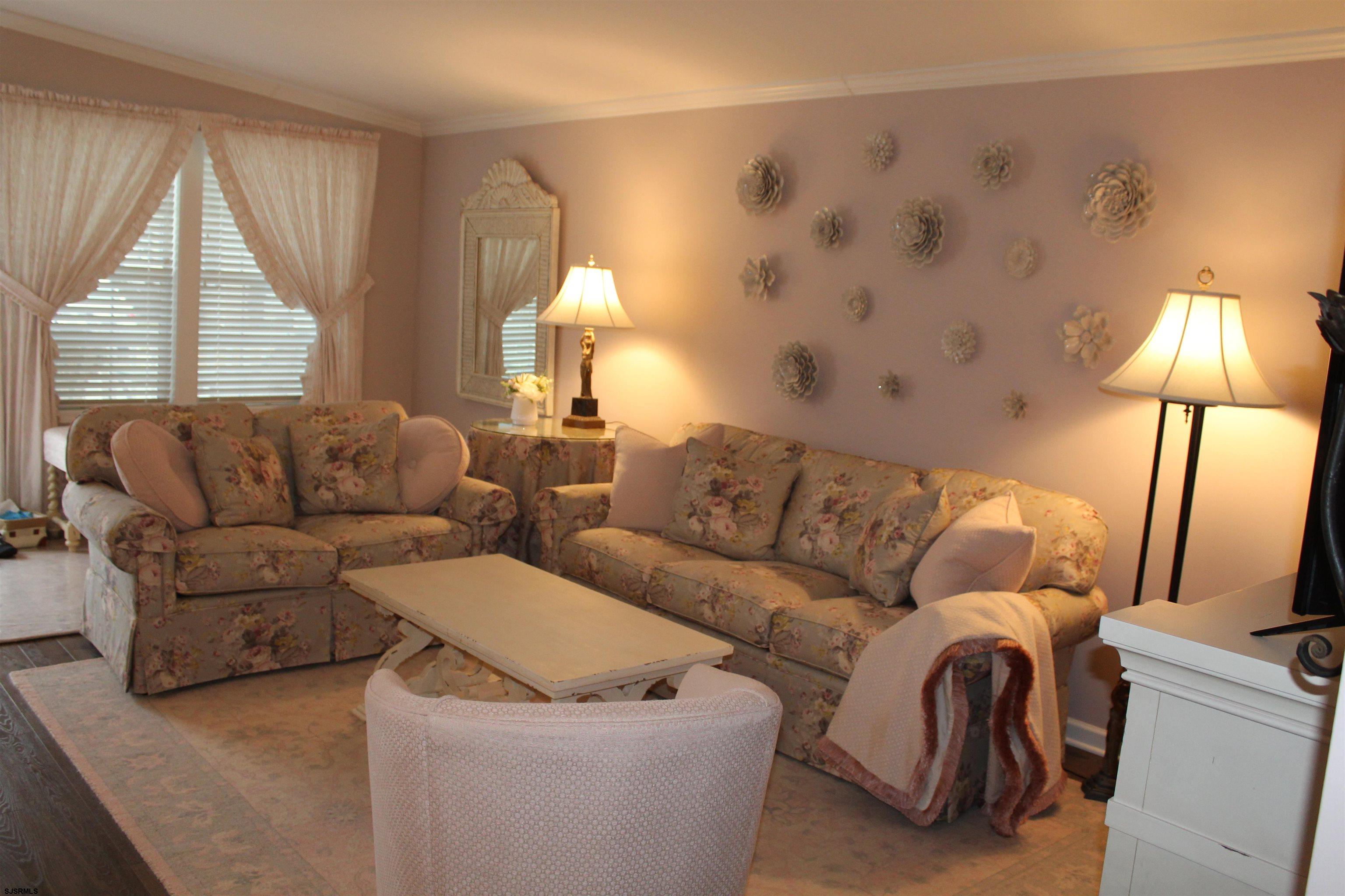 2058 South Shore Road, Unit 210 Ocean View, NJ 08230 - Photo 13 of 17 a living room with furniture and a window