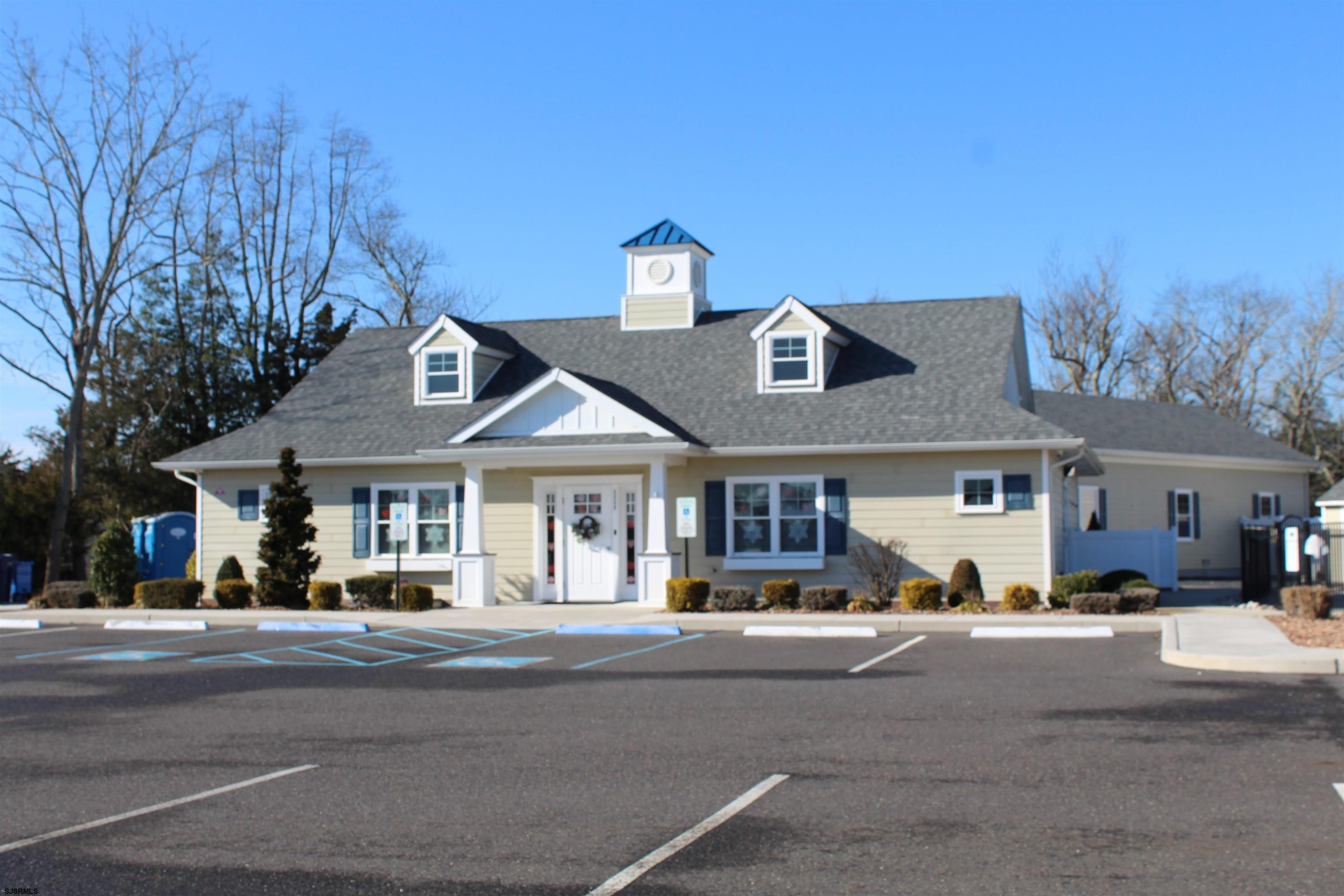 2058 South Shore Road, Unit 210 Ocean View, NJ 08230 - Photo 17 of 17 a front view of a house with a yard