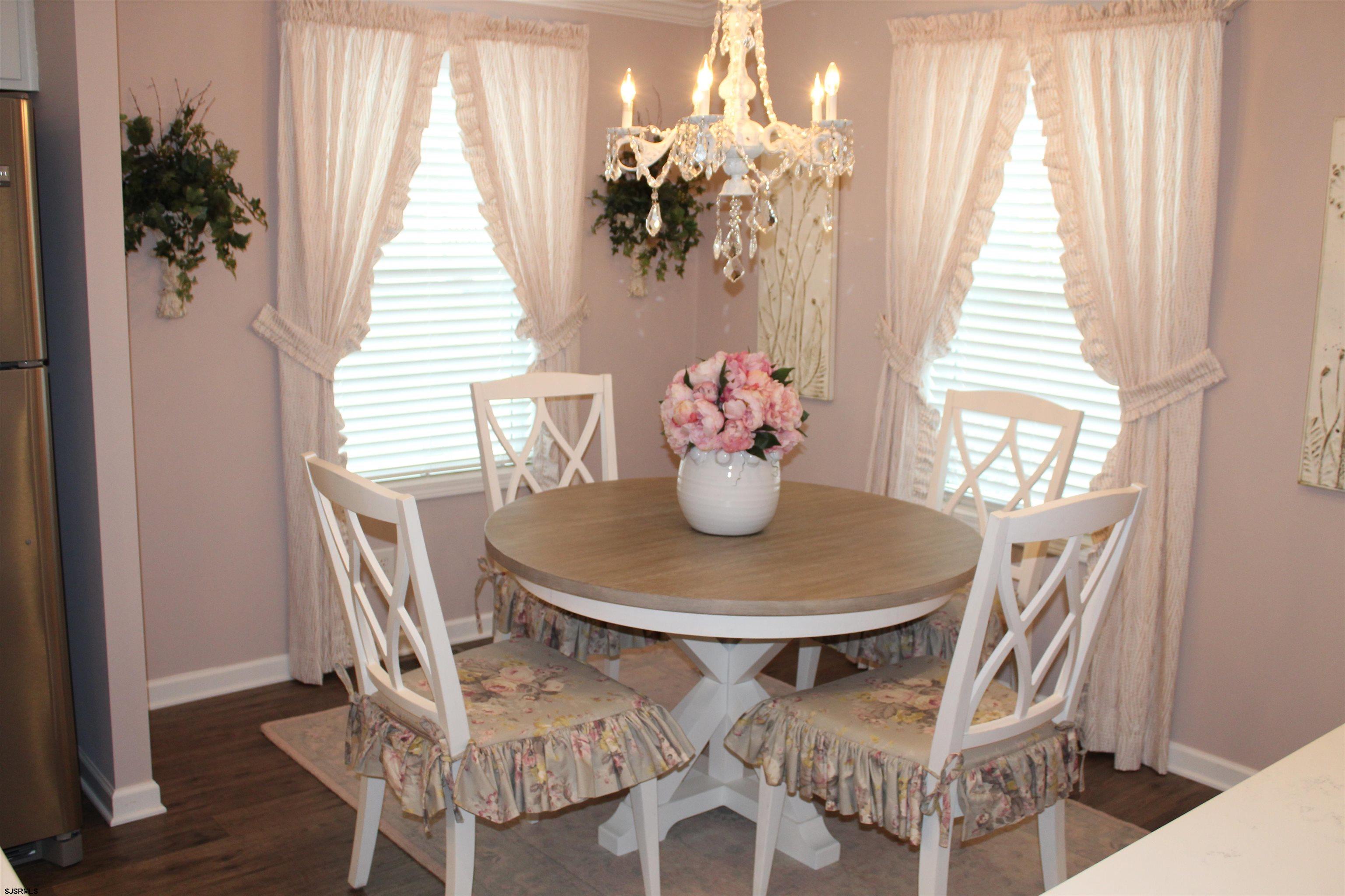 2058 South Shore Road, Unit 210 Ocean View, NJ 08230 - Photo 4 of 17 a dining room with furniture and window