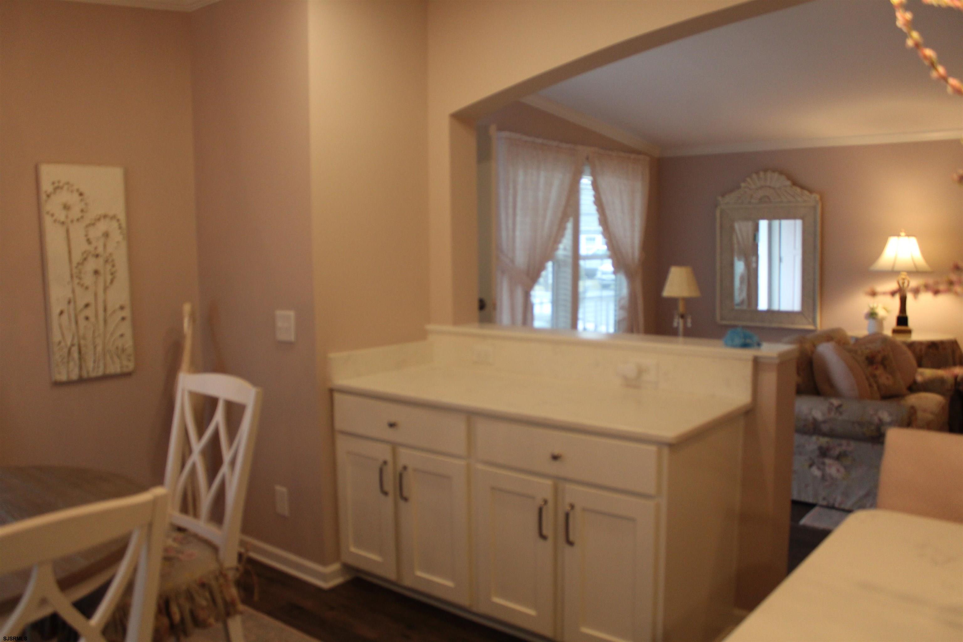 2058 South Shore Road, Unit 210 Ocean View, NJ 08230 - Photo 6 of 17 a view of a hallway with furniture and a window