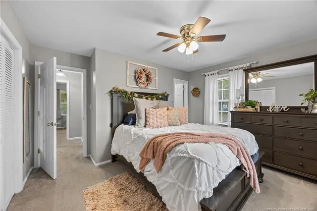 a bed room with a bed and a window