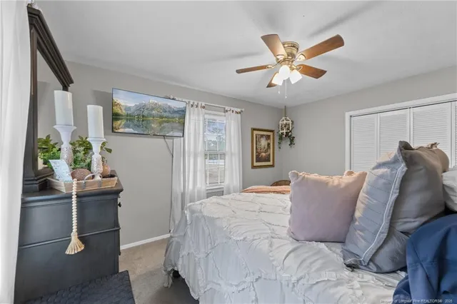 a bathroom with a sink a toilet and shower curtain