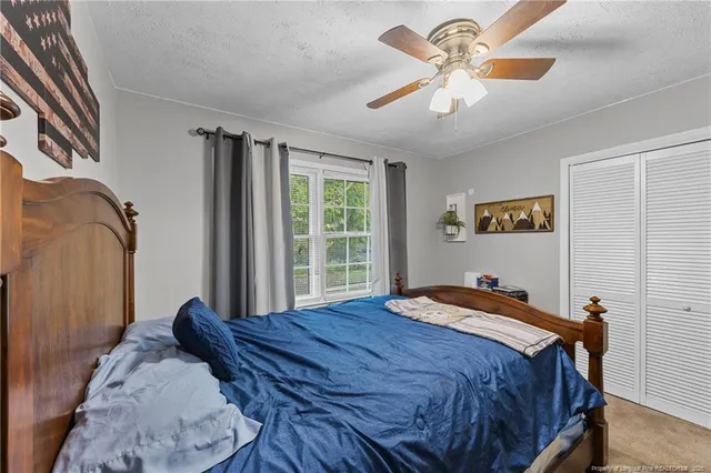 a bathroom with a toilet sink vanity and mirror