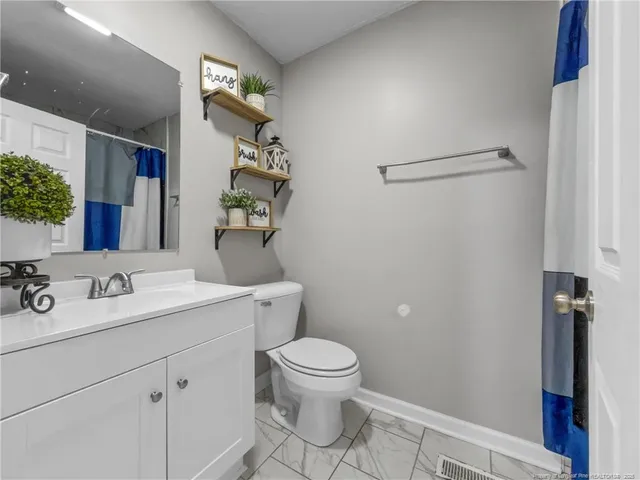 a bedroom with furniture and window