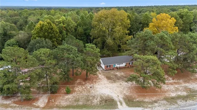 a view of a pool with a yard