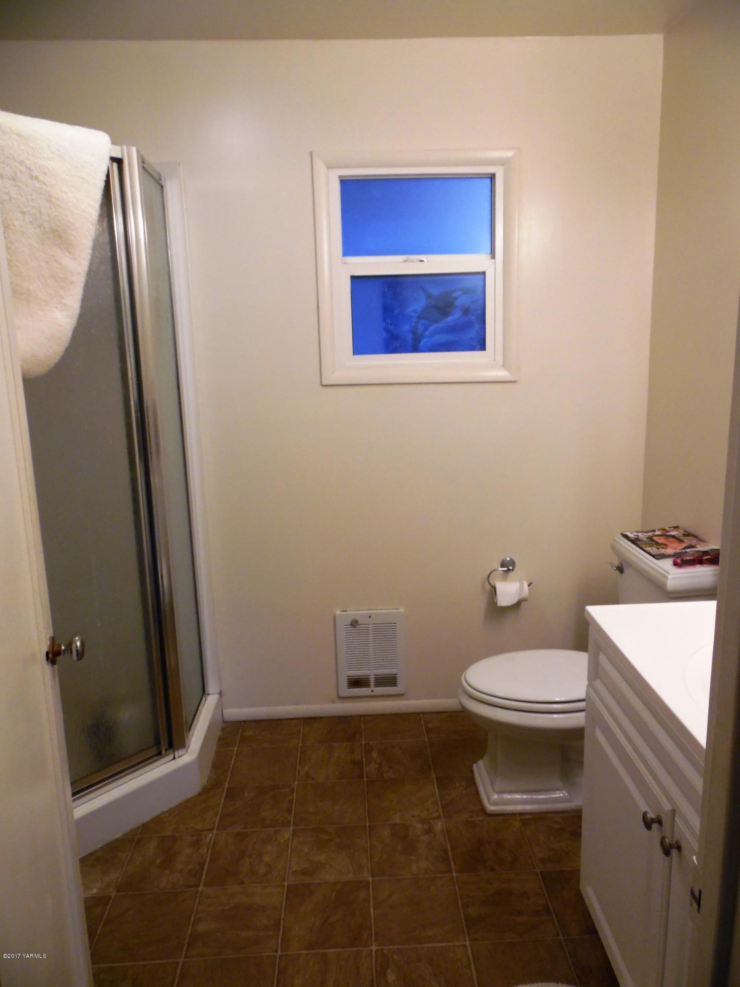 220 Rosenkranz Road Tieton, WA 98947 - Photo 16 of 48 a bathroom with a sink a toilet and a mirror