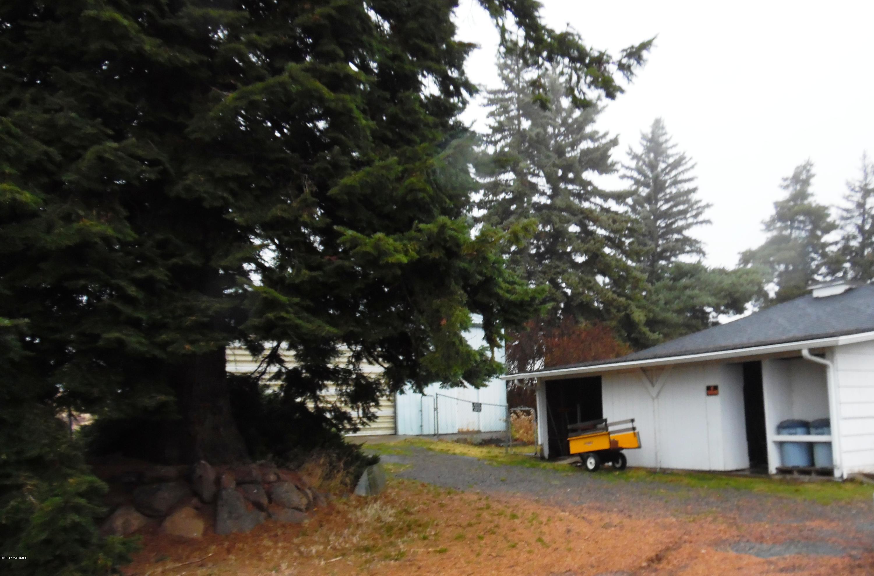 220 Rosenkranz Road Tieton, WA 98947 - Photo 35 of 48 a view of car parked in front of house with trees