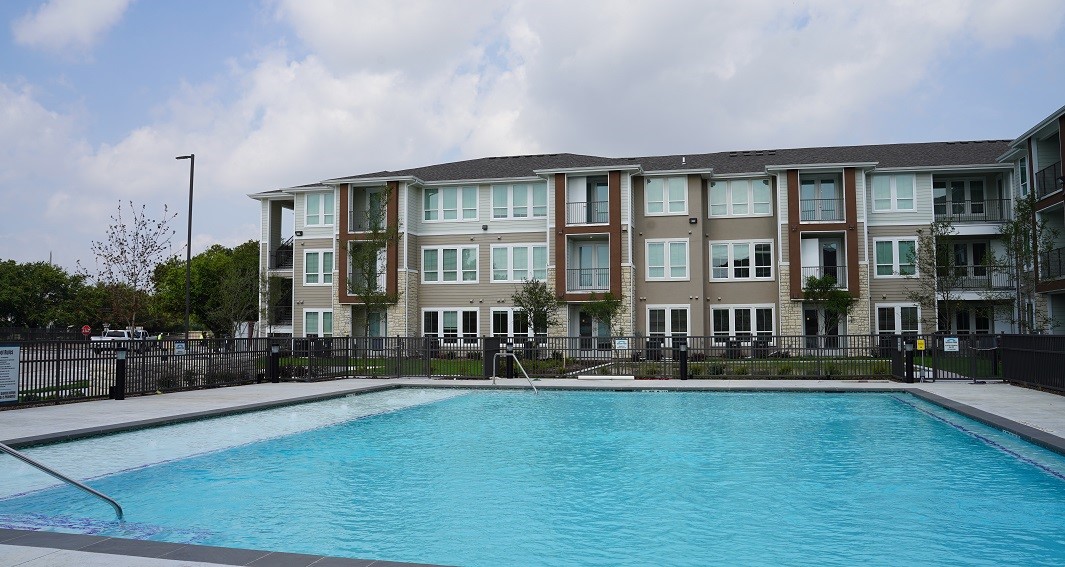 1475 Gears Road Houston, TX 77067 - Photo 5 of 13 a front view of a house with swimming pool and patio