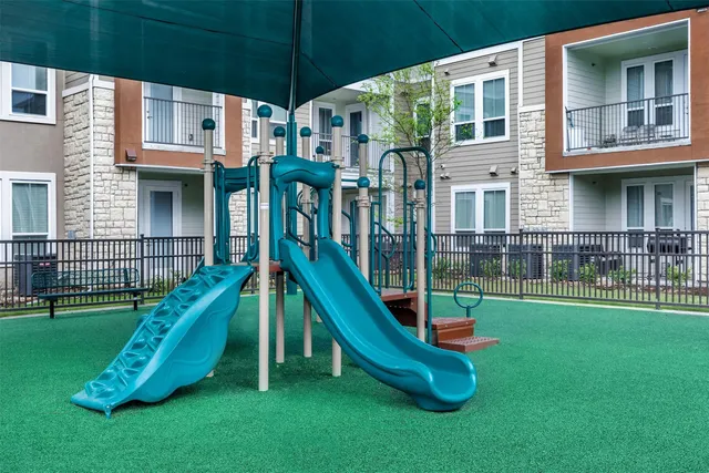 a garden with lots of swings and slides