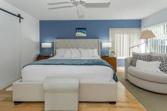 a bedroom with a bed and a couch