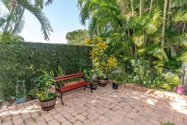 a view of a bench in a backyard