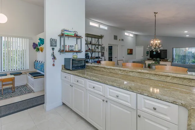 a view of living room with granite countertop furniture and flat screen
