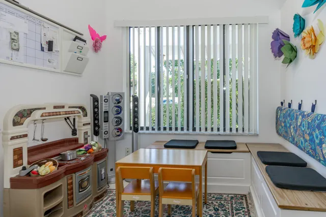 a kitchen with stove and cabinets