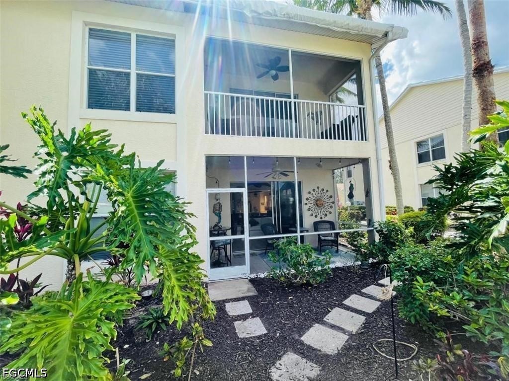 14971 Rivers Edge Court, Unit 101 Fort Myers, FL 33908 - Photo 9 of 9 front view of house with potted plants