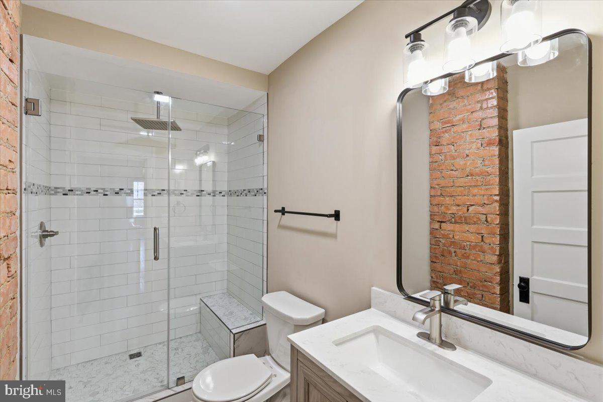 628 Trail Avenue Frederick, MD 21701 - Photo 17 of 37 a bathroom with a sink toilet and shower