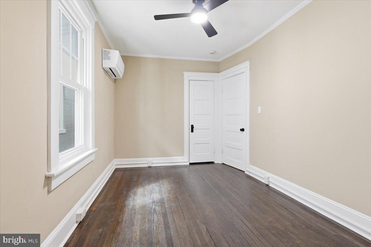 628 Trail Avenue Frederick, MD 21701 - Photo 20 of 37 a view of an empty room with wooden floor and a window