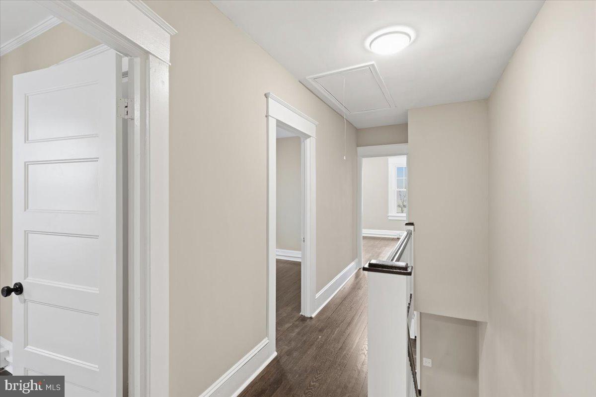 628 Trail Avenue Frederick, MD 21701 - Photo 22 of 37 a view of a hallway with wooden floor and staircase