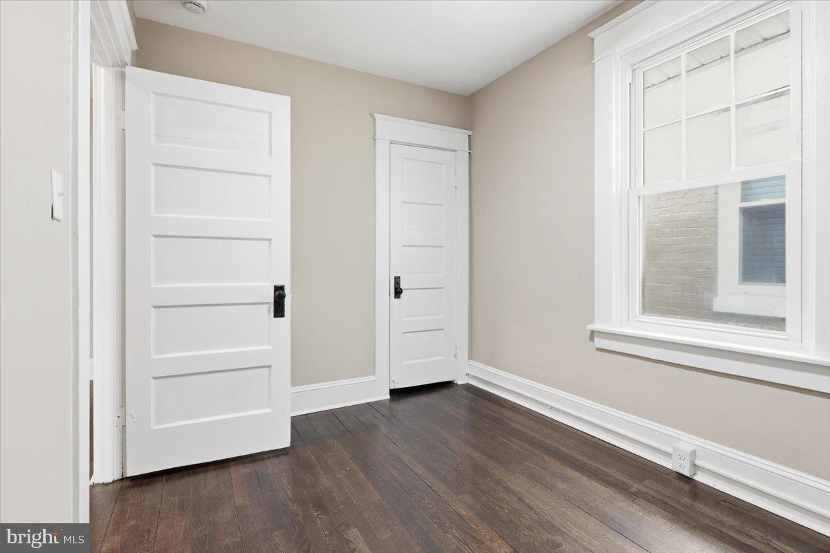 628 Trail Avenue Frederick, MD 21701 - Photo 24 of 37 an empty room with wooden floor closet and windows
