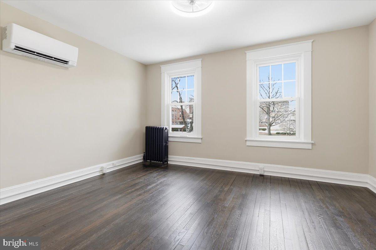628 Trail Avenue Frederick, MD 21701 - Photo 25 of 37 a view of an empty room with wooden floor and a window