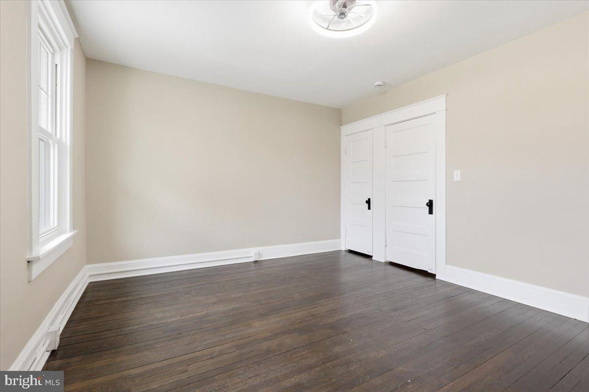 628 Trail Avenue Frederick, MD 21701 - Photo 26 of 37 a view of an empty room with wooden floor