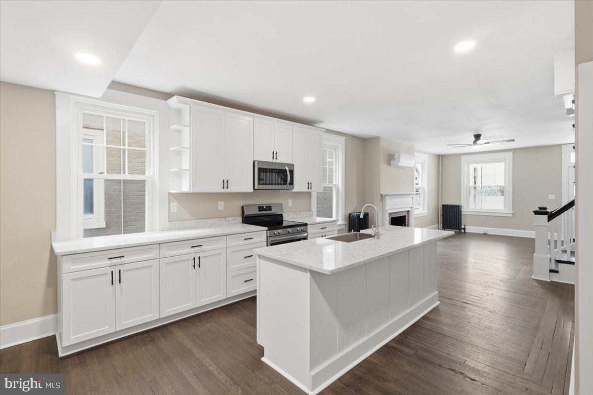 628 Trail Avenue Frederick, MD 21701 - Photo 9 of 37 a large white kitchen with cabinets