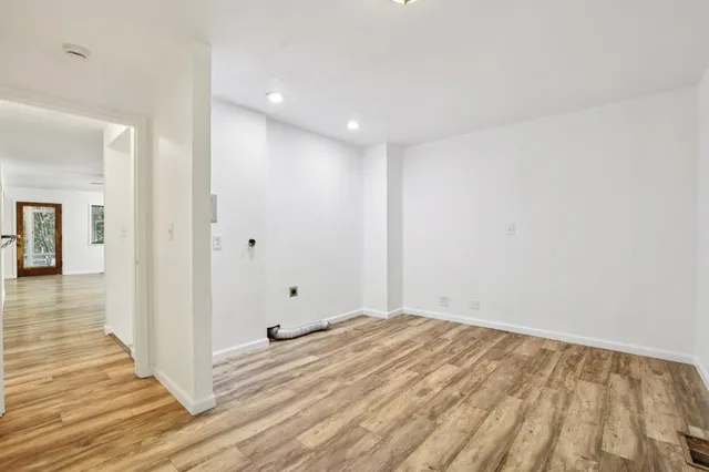 a white bath tub sitting in a bathroom next to a bathroom