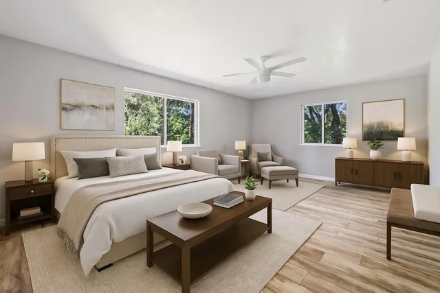 a white bath tub sitting in a bathroom next to a bathroom