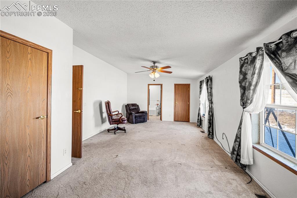 8435 Savage Road Beulah, CO 81023 - Photo 13 of 34 a view of a livingroom with a couch and the entryway