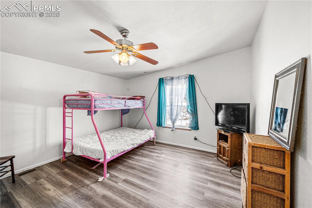 8435 Savage Road Beulah, CO 81023 - Photo 17 of 34 a living room with furniture and a flat screen tv