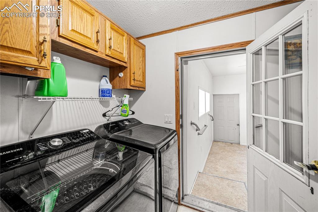 8435 Savage Road Beulah, CO 81023 - Photo 21 of 34 a view of a kitchen with furniture and a stove