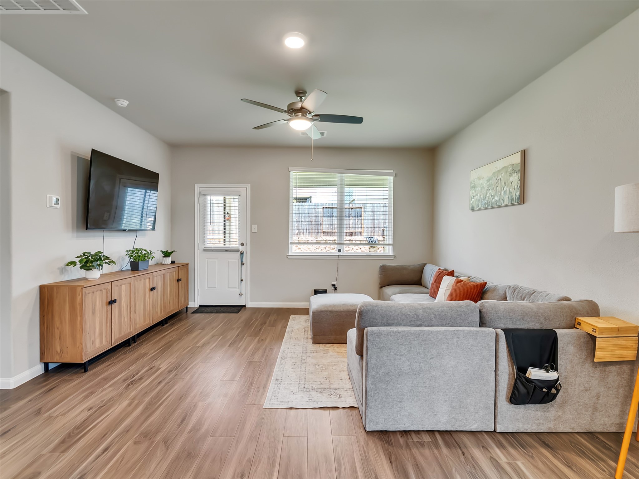 2416 Bluefish Court Conroe, TX 77384 - Photo 30 of 45 a living room with furniture and a flat screen tv